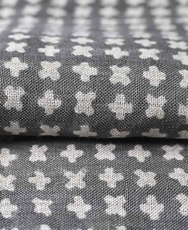 Maker Inspiration: A creative mood board featuring geometric fabric swatches, wood samples, and brass accents, perfect for a modern home-maker's project
