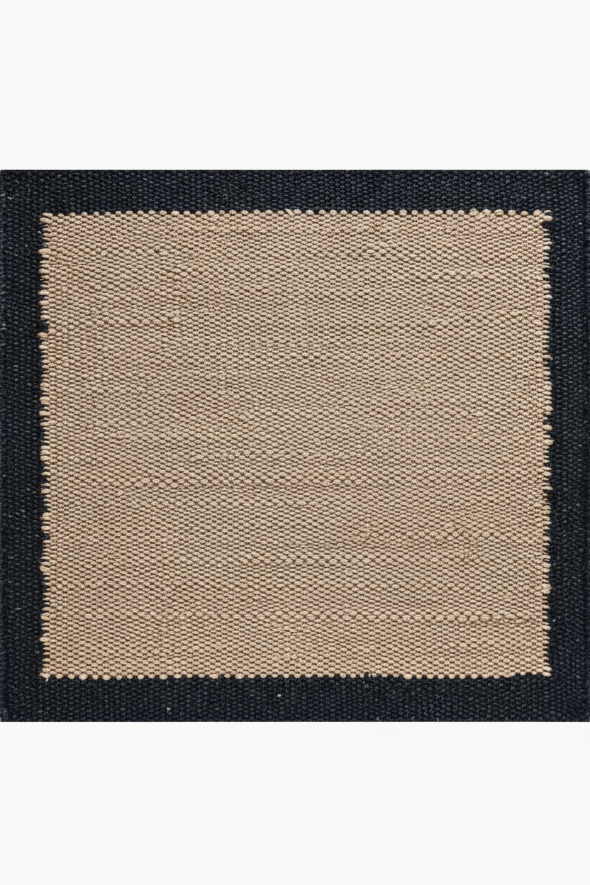 Rectangular rug with black border and beige center on a white background