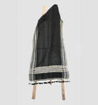Black and gray patterned scarf with tassels on a white background
