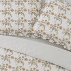 Floral patterned fabric with beige flowers on a white background