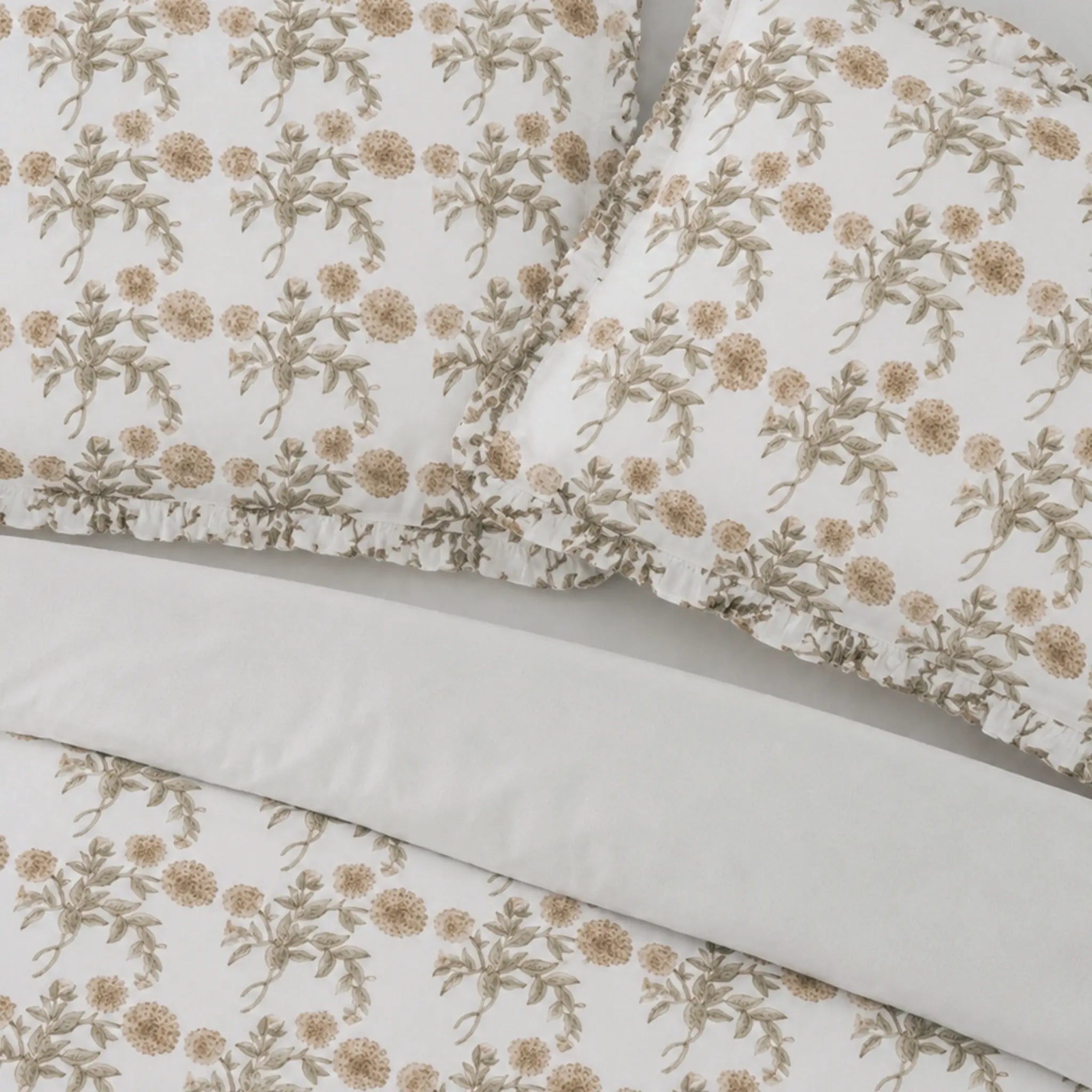 Floral patterned fabric with beige flowers on a white background