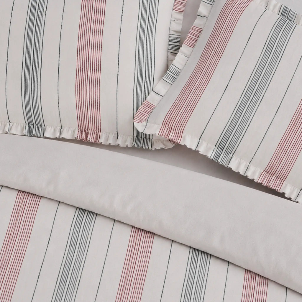 Striped fabric with pink and gray lines on a light gray background