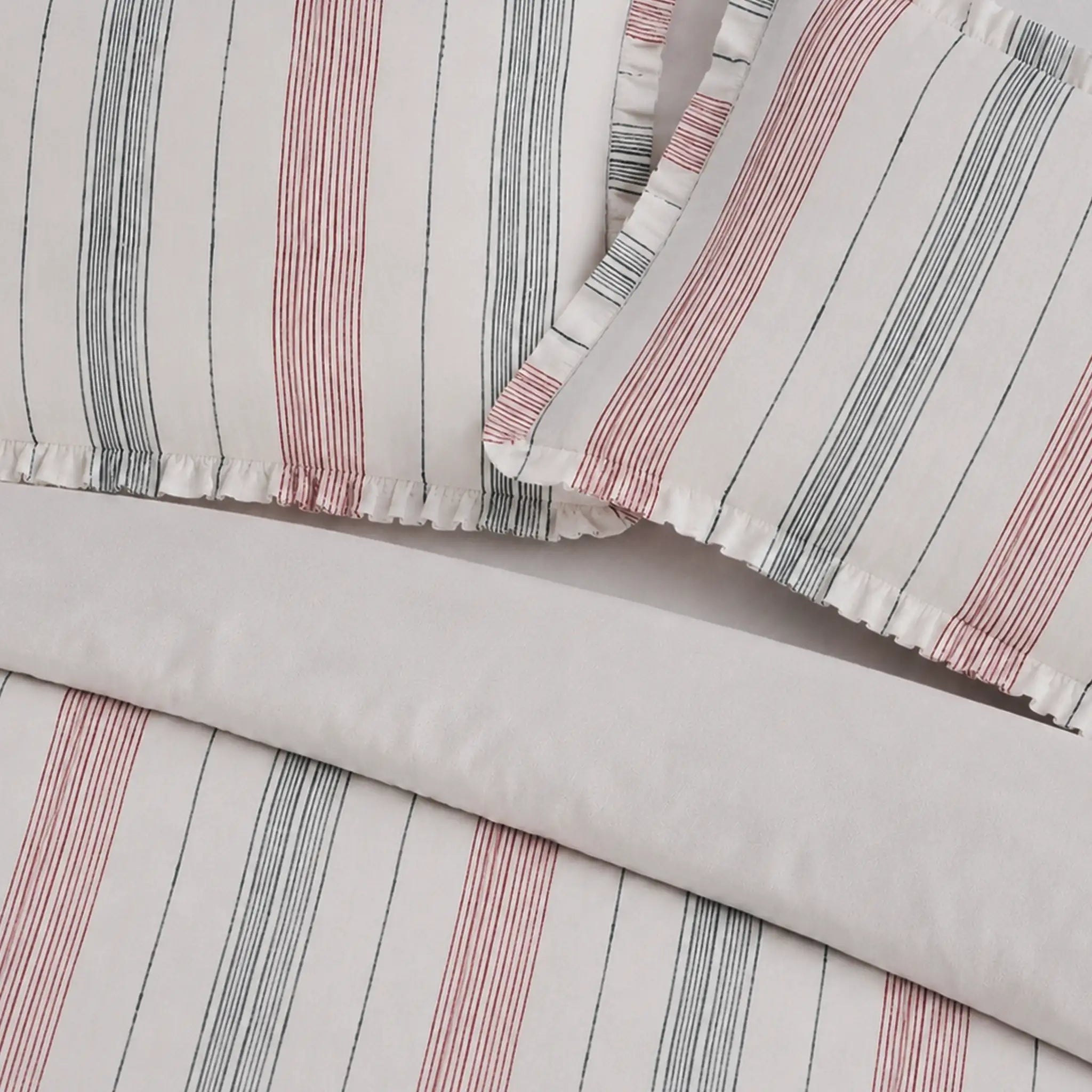 Striped fabric with pink and gray lines on a light gray background