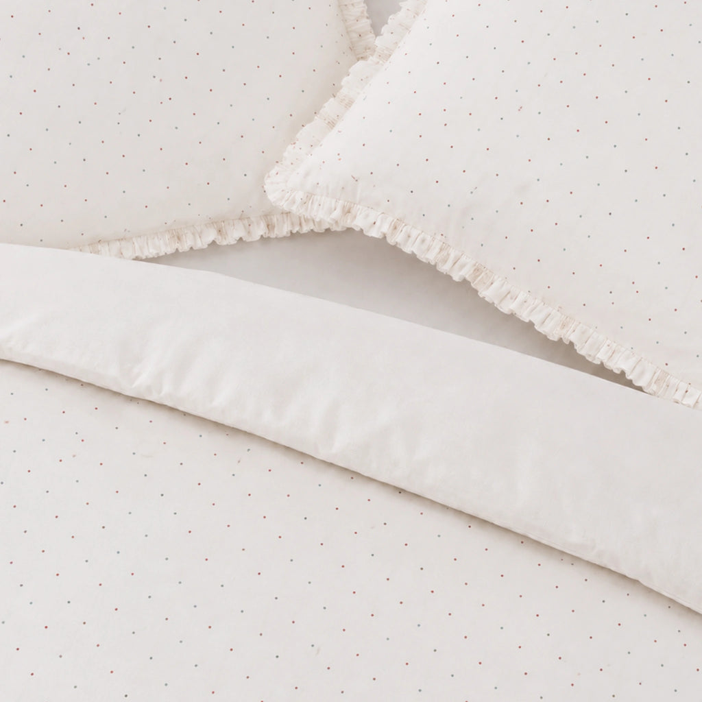 Close-up of a textured white fabric with a subtle pattern