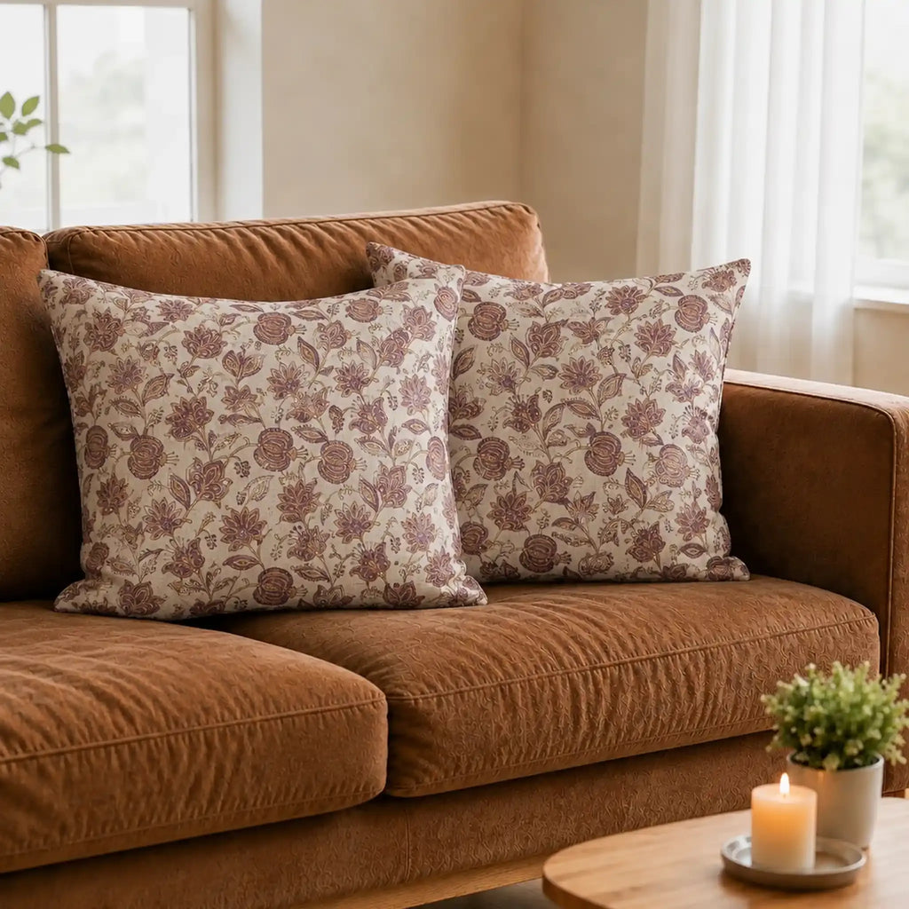 Hand block-printed linen pillow covers featuring purple and plum botanical floral vines on a natural ground.
