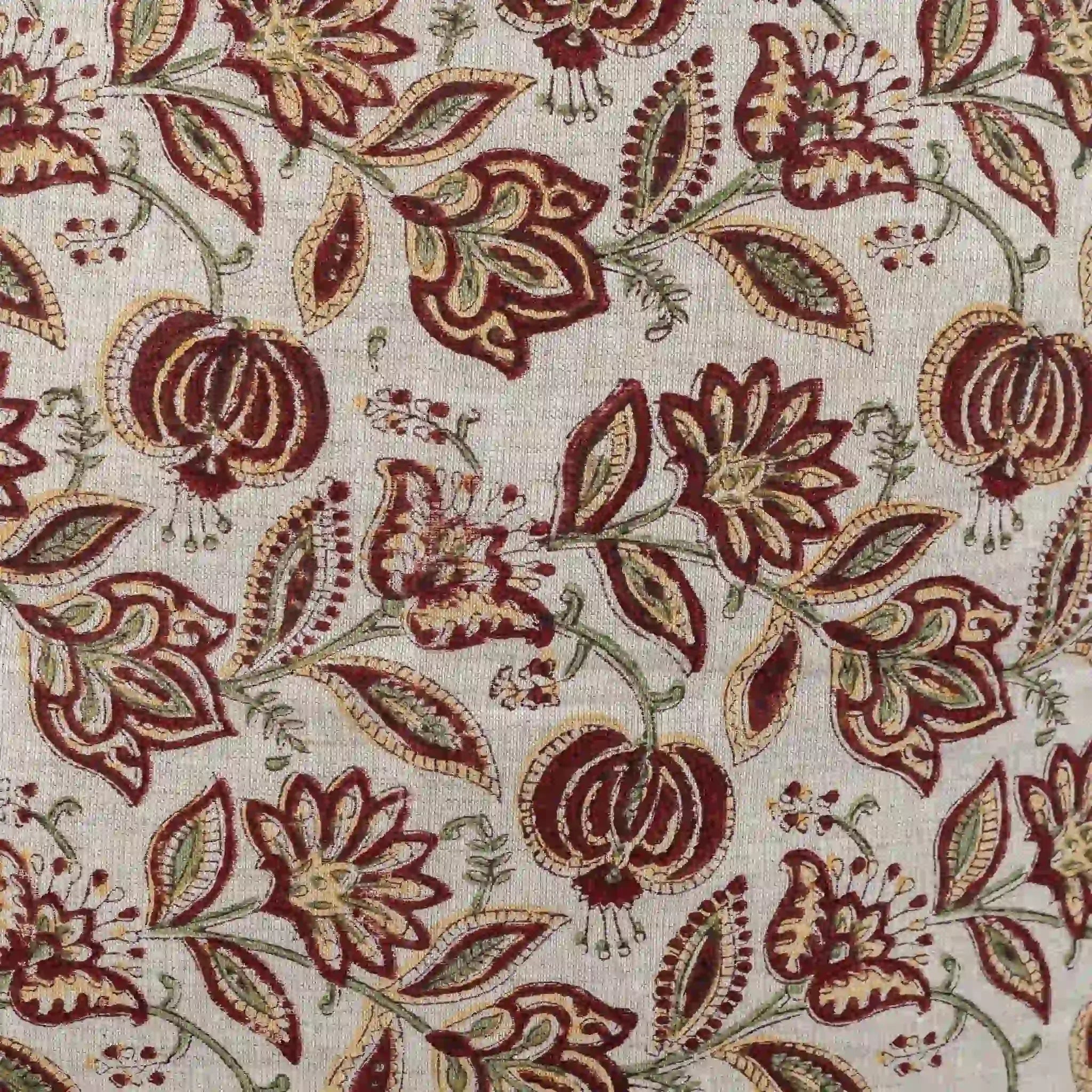 Hand block printed natural linen pillow cover featuring a botanical floral vine motif in red and plum wine.
