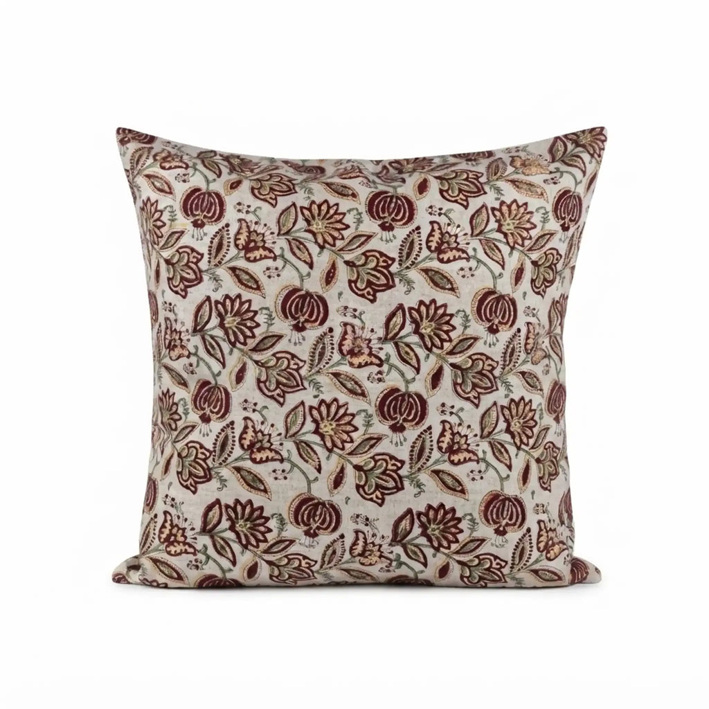 Hand block printed linen pillow cover in natural, red, and plum wine with a botanical floral vine pattern.
