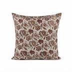 Hand block printed linen pillow cover in natural, red, and plum wine with a botanical floral vine pattern.