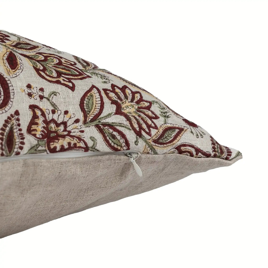Hand block printed natural linen pillow cover with red and plum botanical floral vine motifs and a hidden zipper.