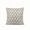 Natural linen pillow cover featuring a hand-block printed sage green and blue floral buti motif on a neutral ground.