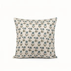 Natural linen pillow cover featuring a hand-block printed sage green and blue floral buti motif on a neutral ground.