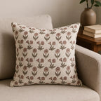 Hand block printed natural linen pillow cover featuring a pink and plum floral buti motif on a neutral ground.
