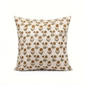 Natural linen pillow cover featuring a hand-blocked mustard and olive floral buti print on a neutral ground.