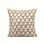 Natural linen pillow cover featuring a hand-blocked mustard and olive floral buti print on a neutral ground.