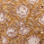 Mustard linen pillow cover featuring a hand-block printed botanical floral vine motif in pink beige and red.