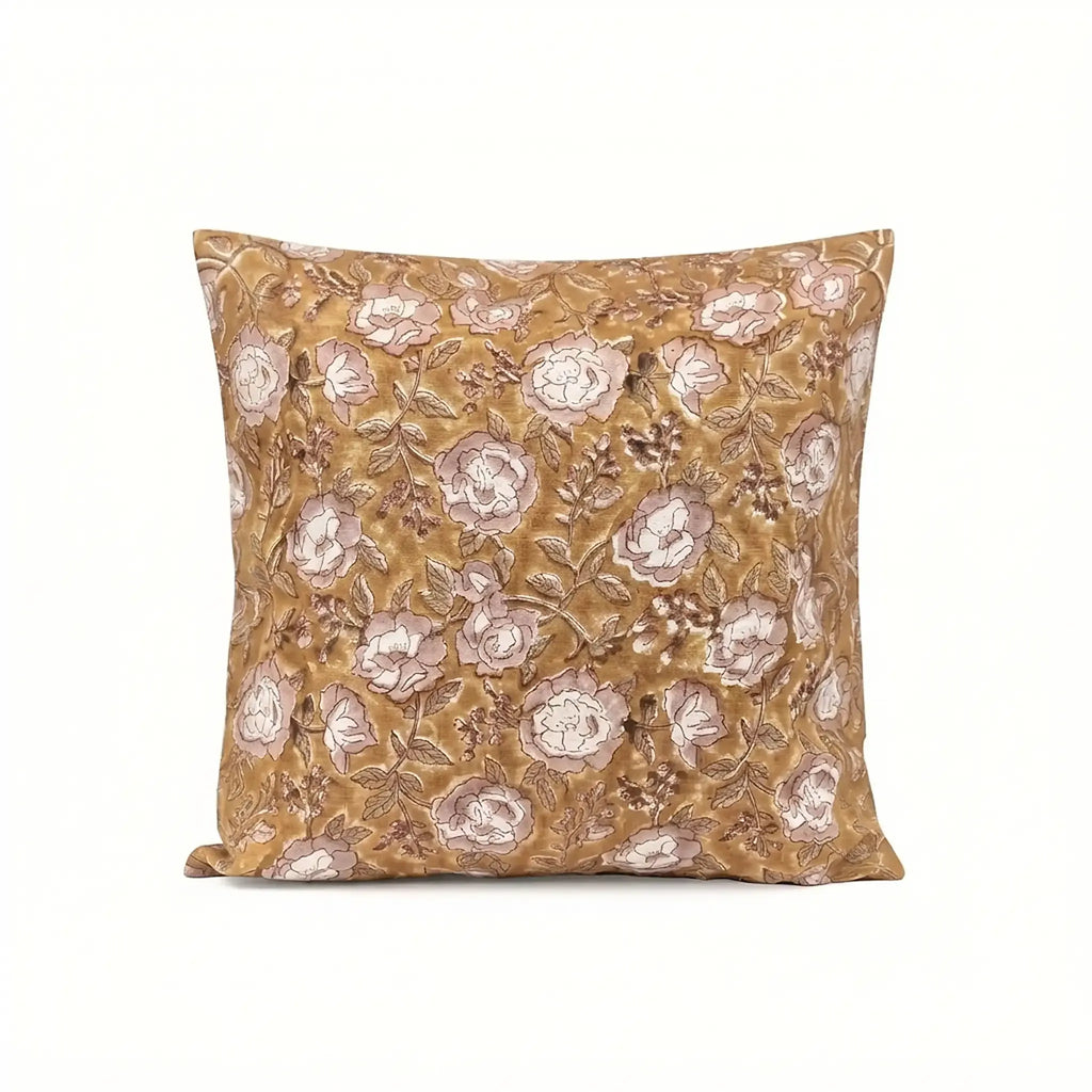 Mustard linen pillow cover with hand block-printed pink beige floral vine motif and red outlines.