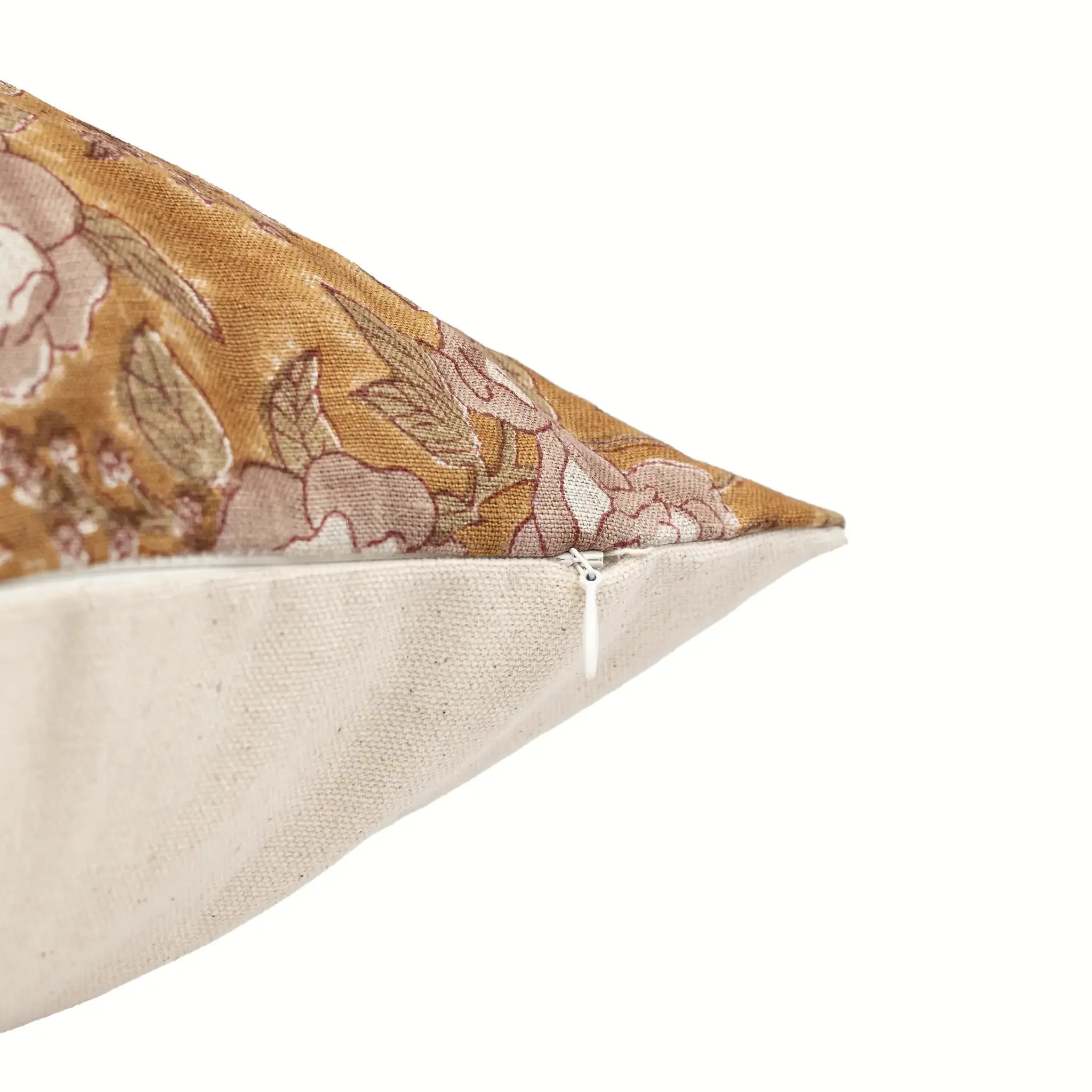 Hand block printed mustard linen pillow cover with pink beige floral vine motif and hidden zipper closure.
