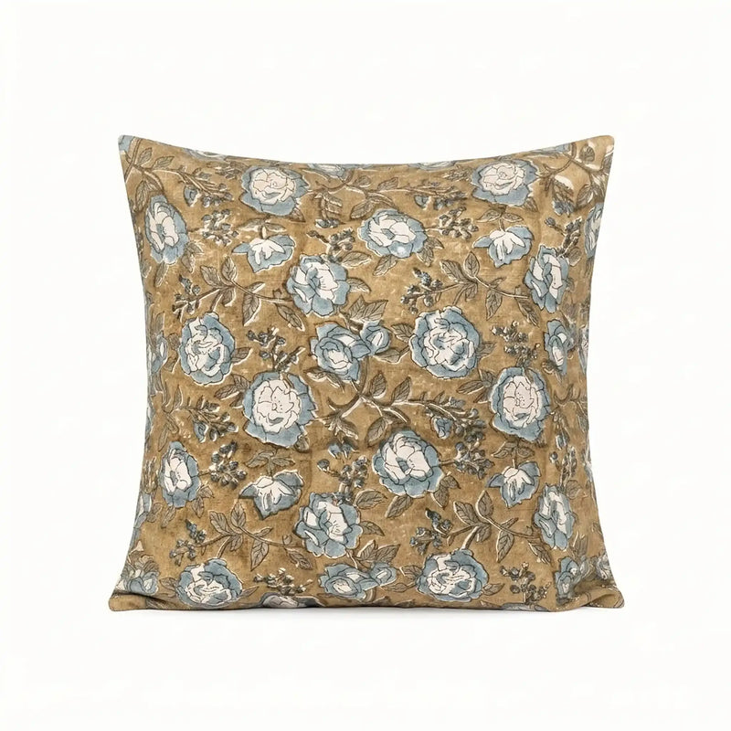 Hand block printed linen pillow cover in beige with ice blue floral vines and brown outlines.