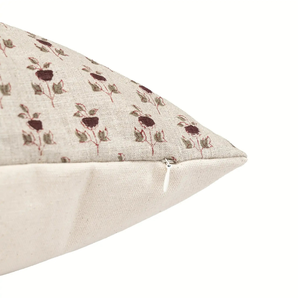 Hand block printed linen pillow cover in natural with plum and red ditsy floral buti motifs and a hidden zipper.