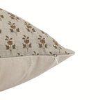 Hand block printed natural linen pillow cover with beige and plum wine floral buti motifs and a hidden zipper closure.