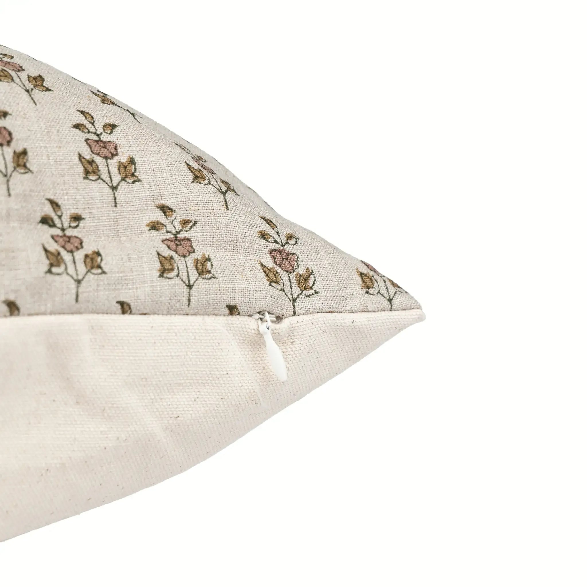 Hand block printed natural linen pillow cover with blush pink and olive green floral buti motifs and side zipper.