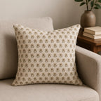 Natural linen pillow cover featuring a hand block-printed sage green and beige floral buti pattern on a neutral ground.