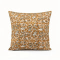 Mustard linen pillow cover with hand-blocked pale green and brown floral vine pattern.