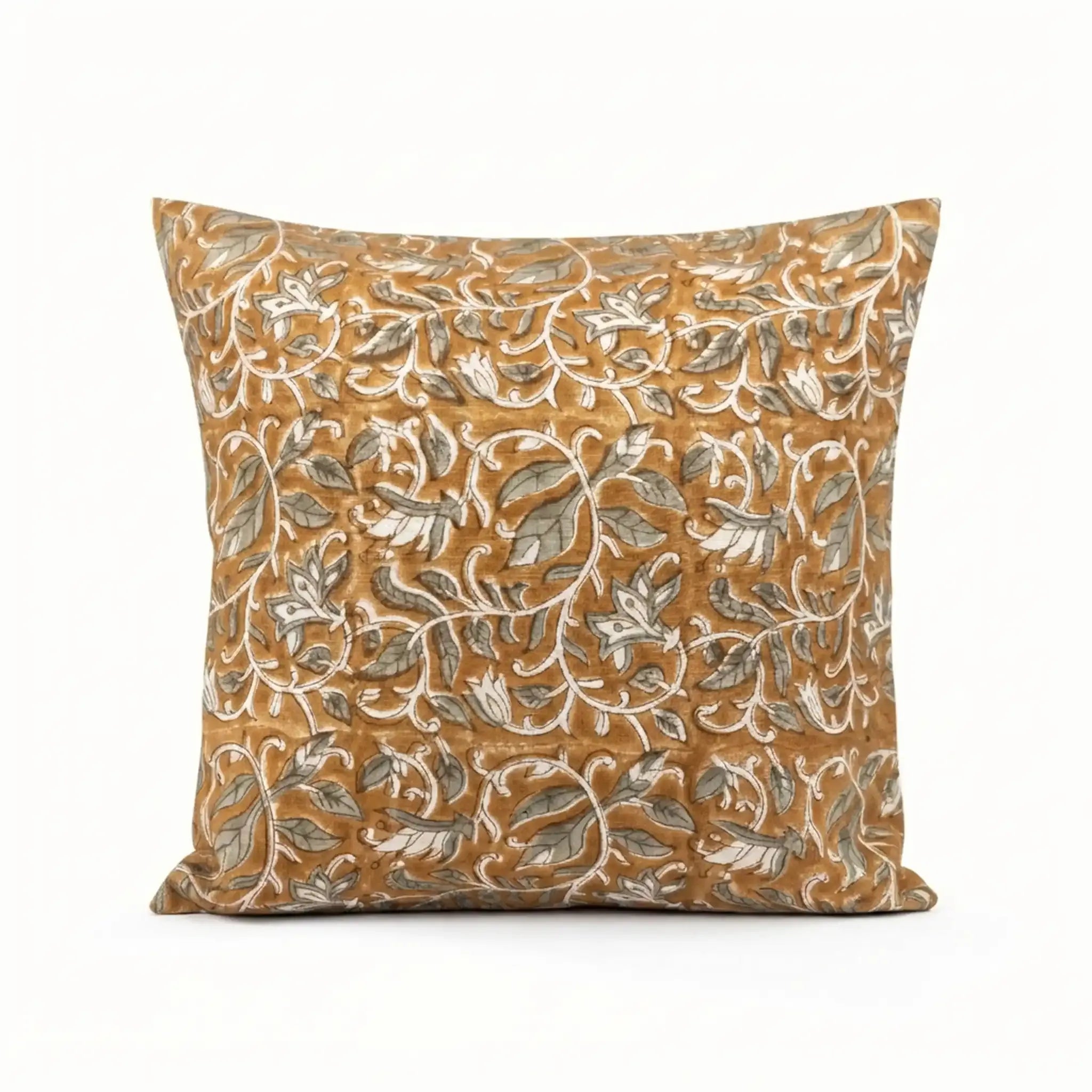 Mustard linen pillow cover with hand-blocked pale green and brown floral vine pattern.