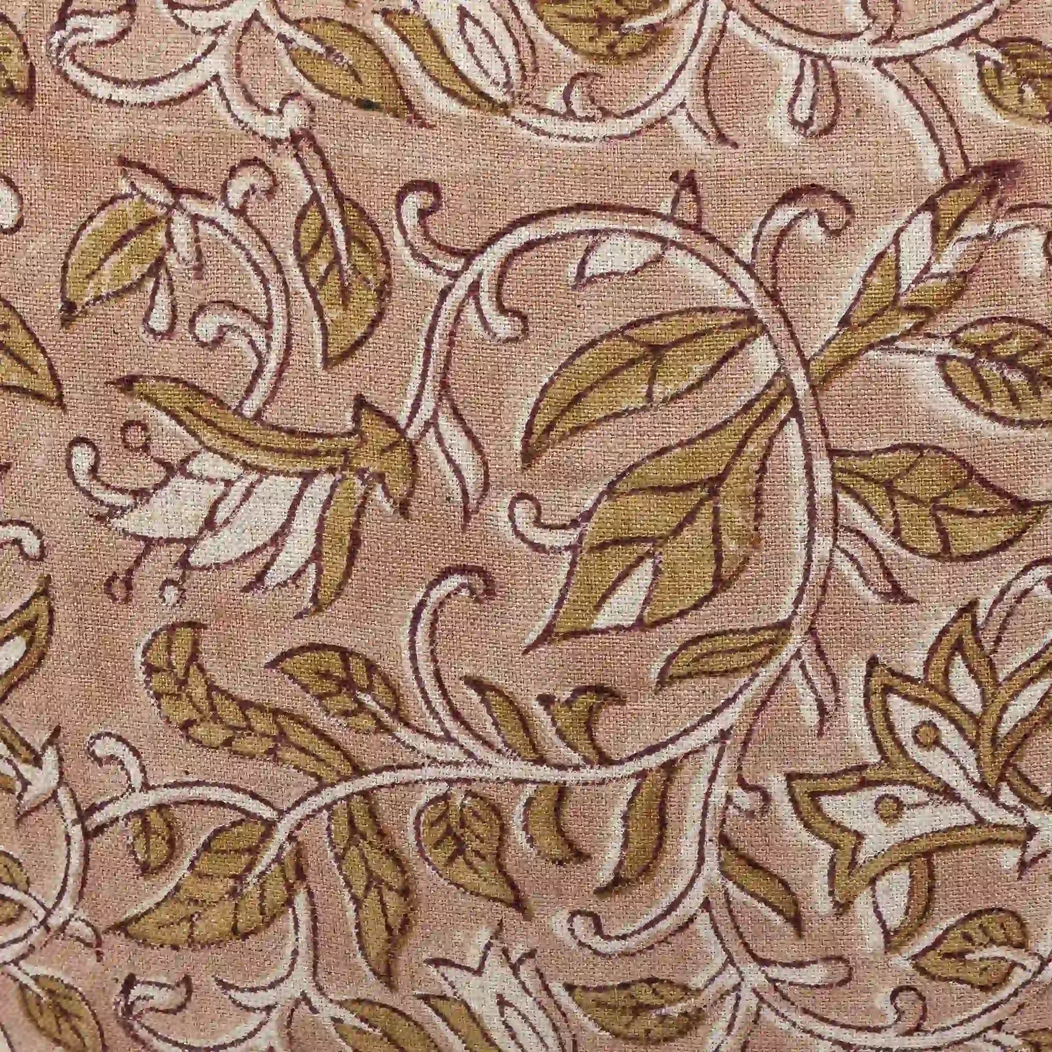 Hand block printed linen pillow cover featuring a floral vine motif in beige and plum wine on a dawn pink background.