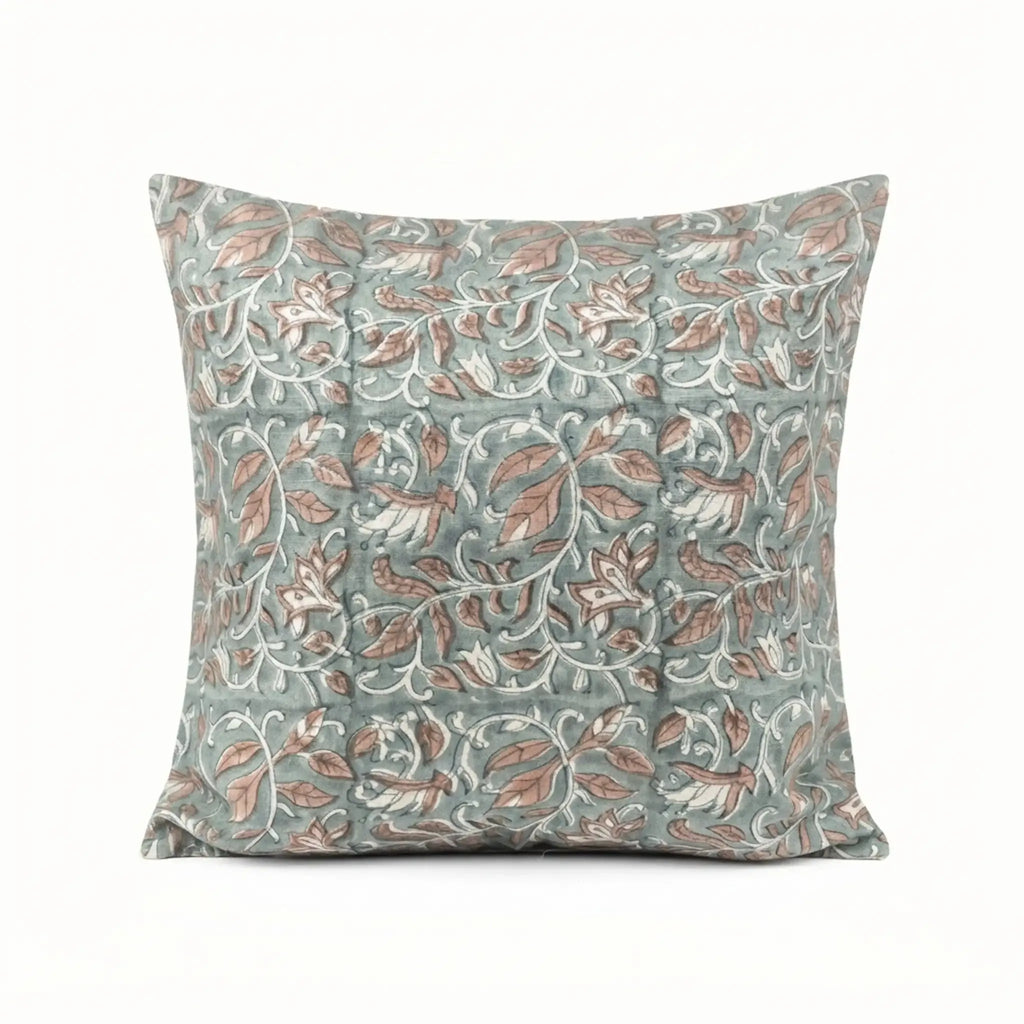 Hand block printed linen pillow cover in ice blue with blush pink floral vine motifs and blue outlines.