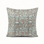 Hand block printed linen pillow cover in ice blue with blush pink floral vine motifs and blue outlines.