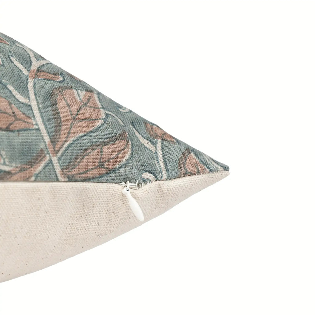 Hand block printed linen pillow cover in ice blue and blush pink with a floral vine pattern and hidden zipper.