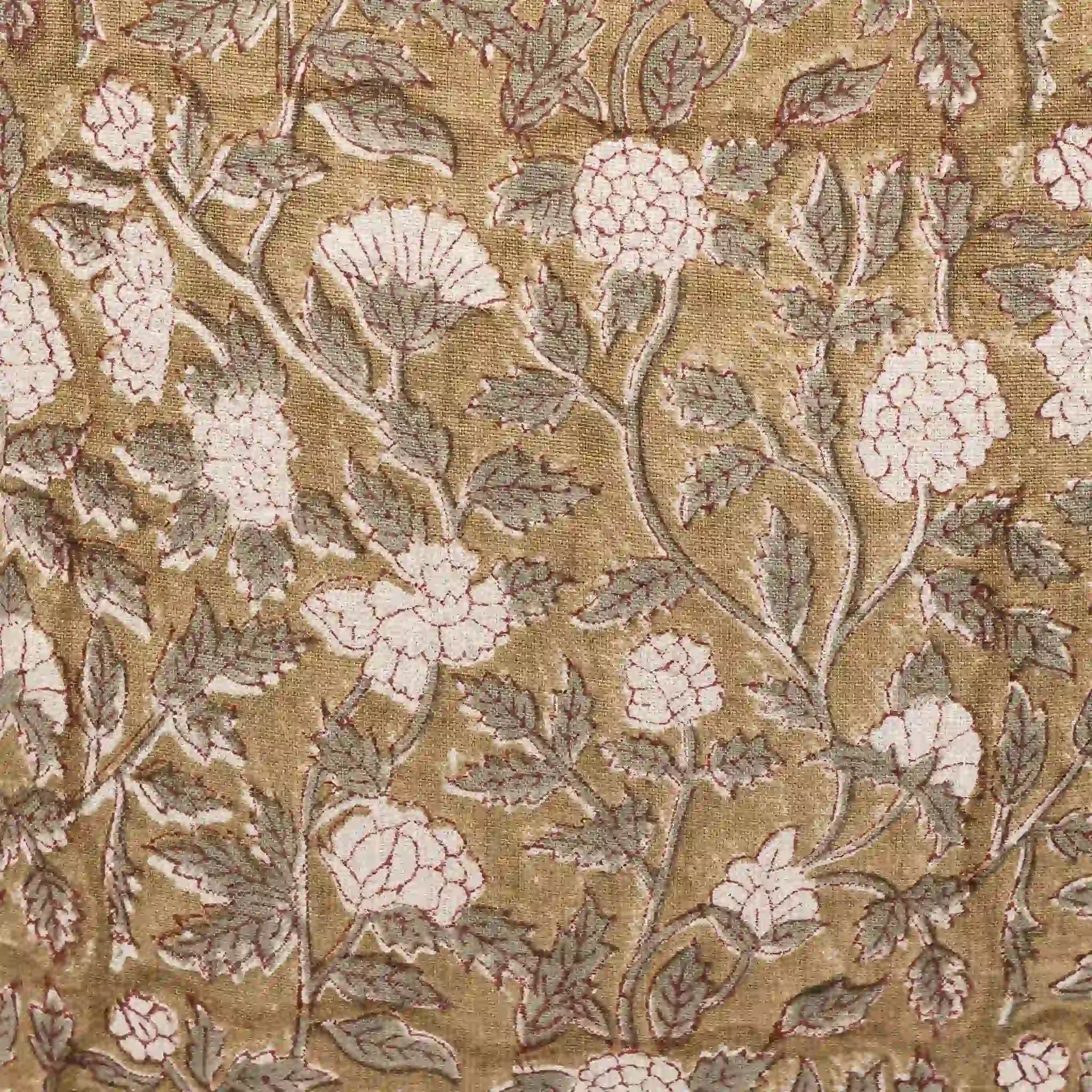 Hand block printed beige linen pillow cover with pale green floral vines and red outlines.