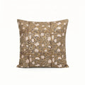 Hand block printed beige linen pillow cover featuring a pale green and red floral vine motif on a textured fabric.