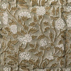 Hand block printed pale green linen pillow cover featuring beige floral rosettes and olive green vine motifs.