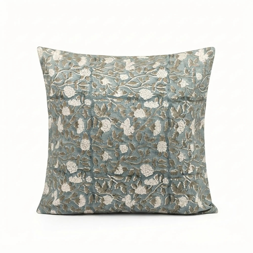 Hand block printed ice blue linen pillow cover featuring a pale green botanical floral vine pattern.