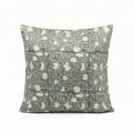Hand block printed ice blue linen pillow cover featuring a pale green botanical floral vine pattern.