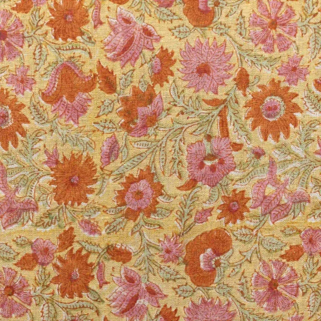 Hand block printed linen pillow cover featuring orange and dusk orange botanical floral vines on a lemon yellow ground.