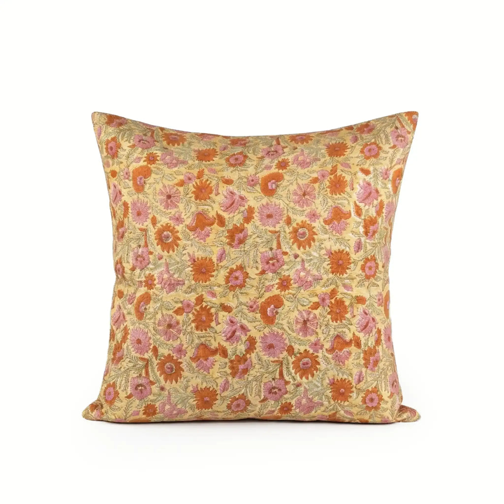 Hand block printed linen pillow cover in lemon yellow with orange and dusk orange botanical floral vine patterns.