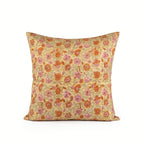 Hand block printed linen pillow cover in lemon yellow with orange and dusk orange botanical floral vine patterns.