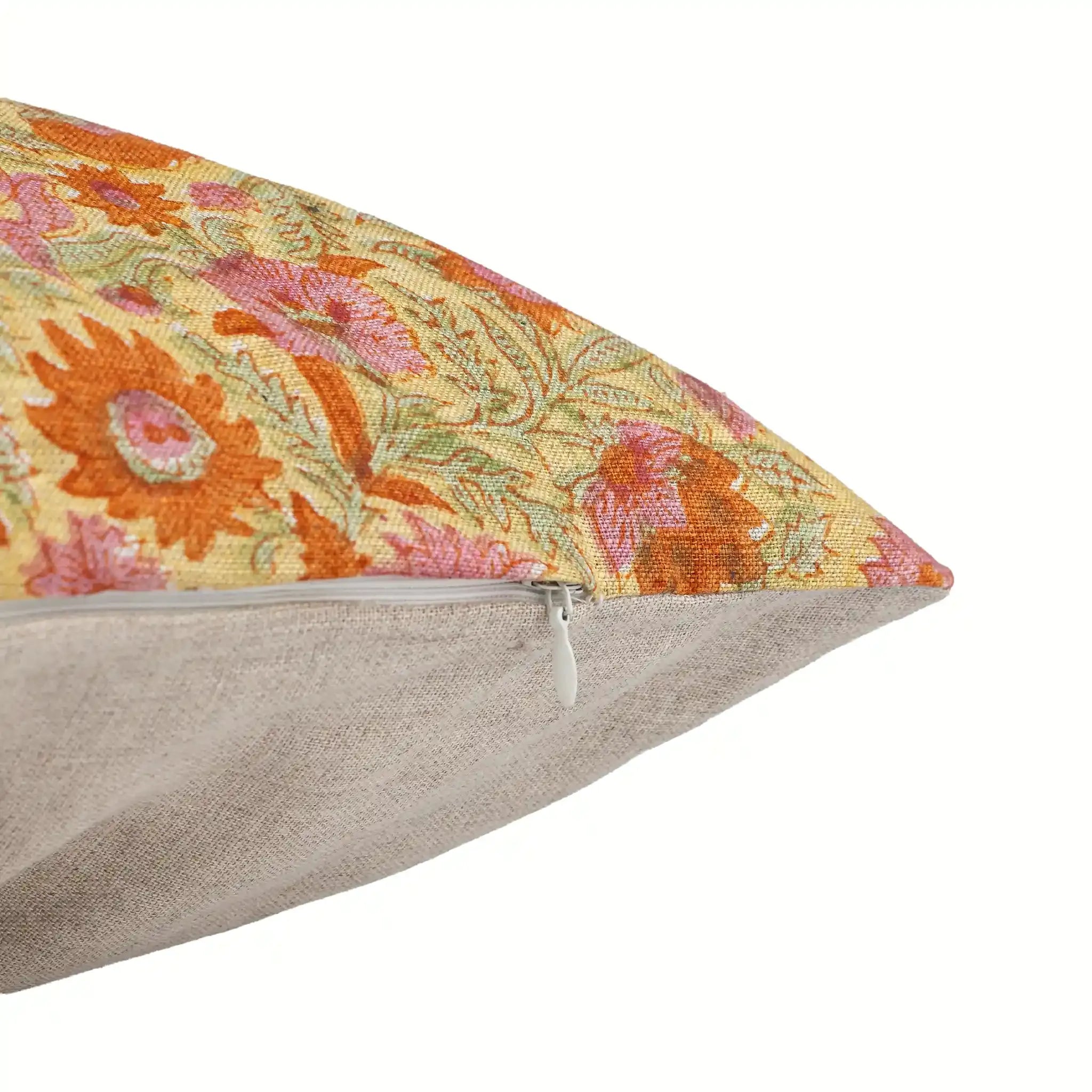 Hand block printed lemon yellow linen pillow cover featuring orange floral vines and a discreet side zipper.