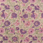 Hand block printed linen pillow cover featuring blush pink and olive green floral vines on a light beige ground.