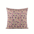 Hand block printed linen pillow cover in light beige with blush pink and olive green floral vine motifs.