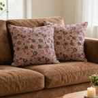 Hand block printed linen pillow covers featuring blush pink and olive green floral vines on a light beige ground.