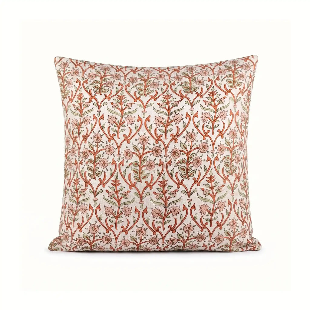 Hand block printed linen pillow cover in natural with dusk orange and brown botanical floral vine motifs.