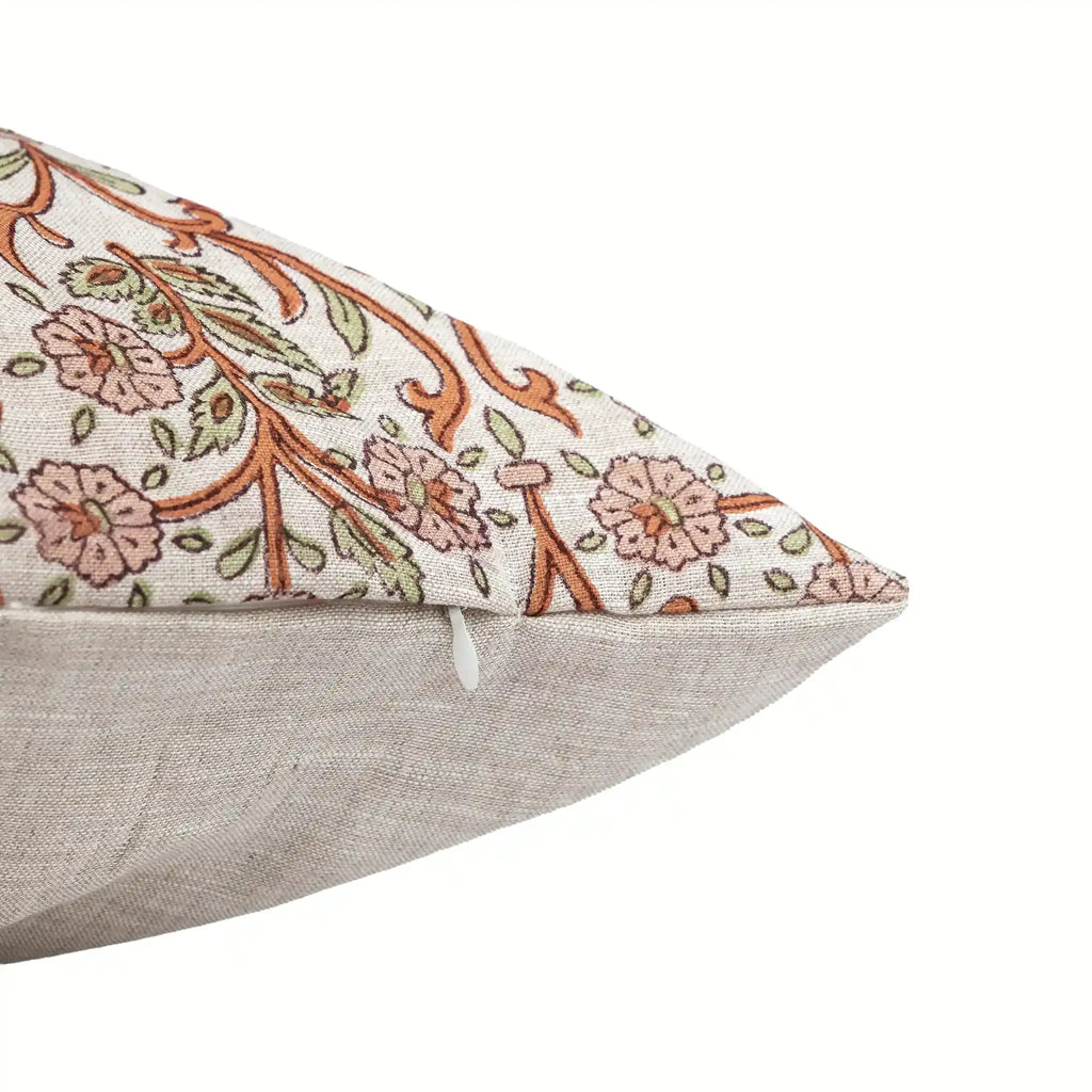 Hand block printed linen pillow cover featuring a natural ground with dusk orange and brown floral vine motifs.