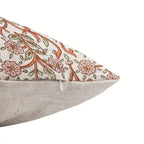 Hand block printed linen pillow cover featuring a natural ground with dusk orange and brown floral vine motifs.