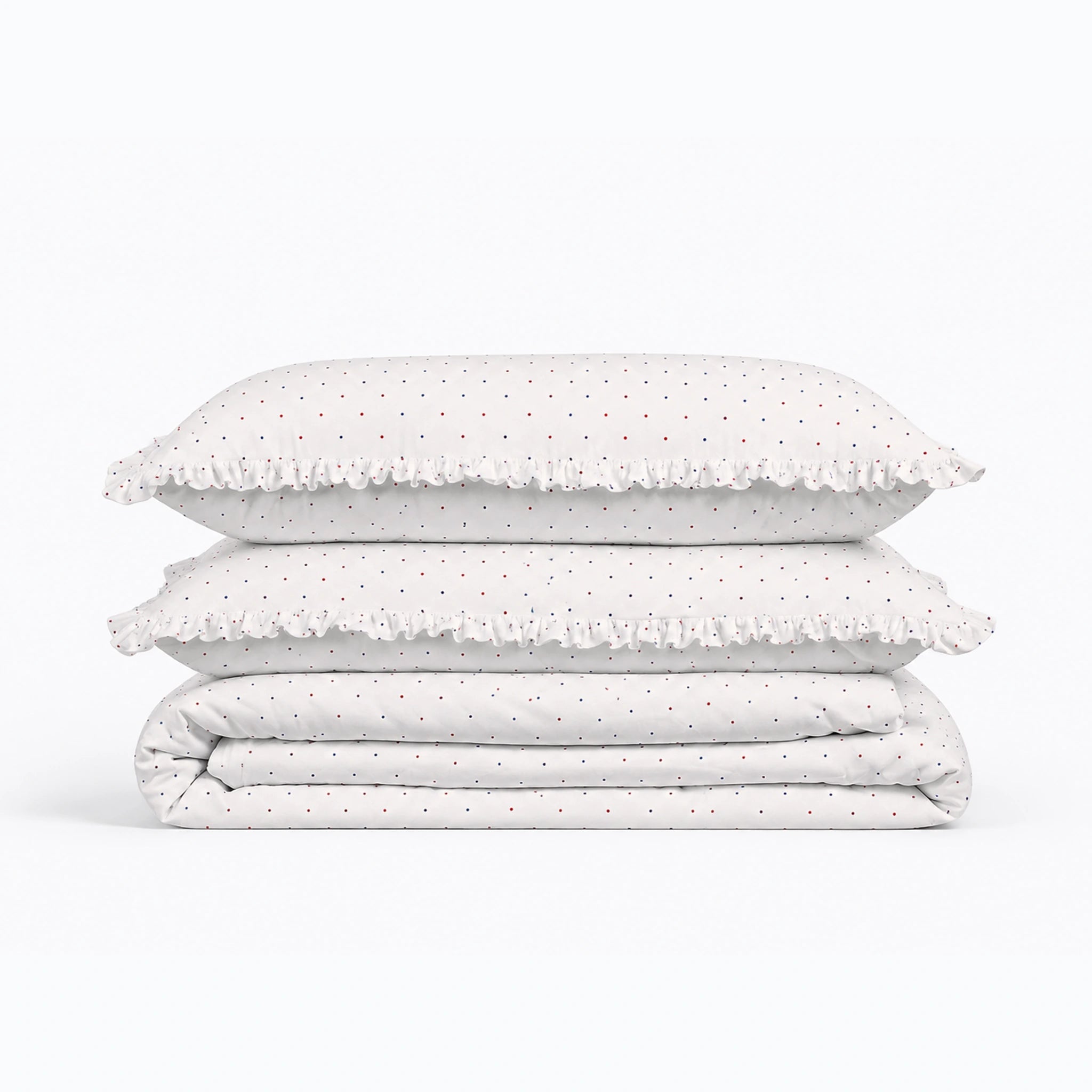 Stack of polka dot bedding on a white background