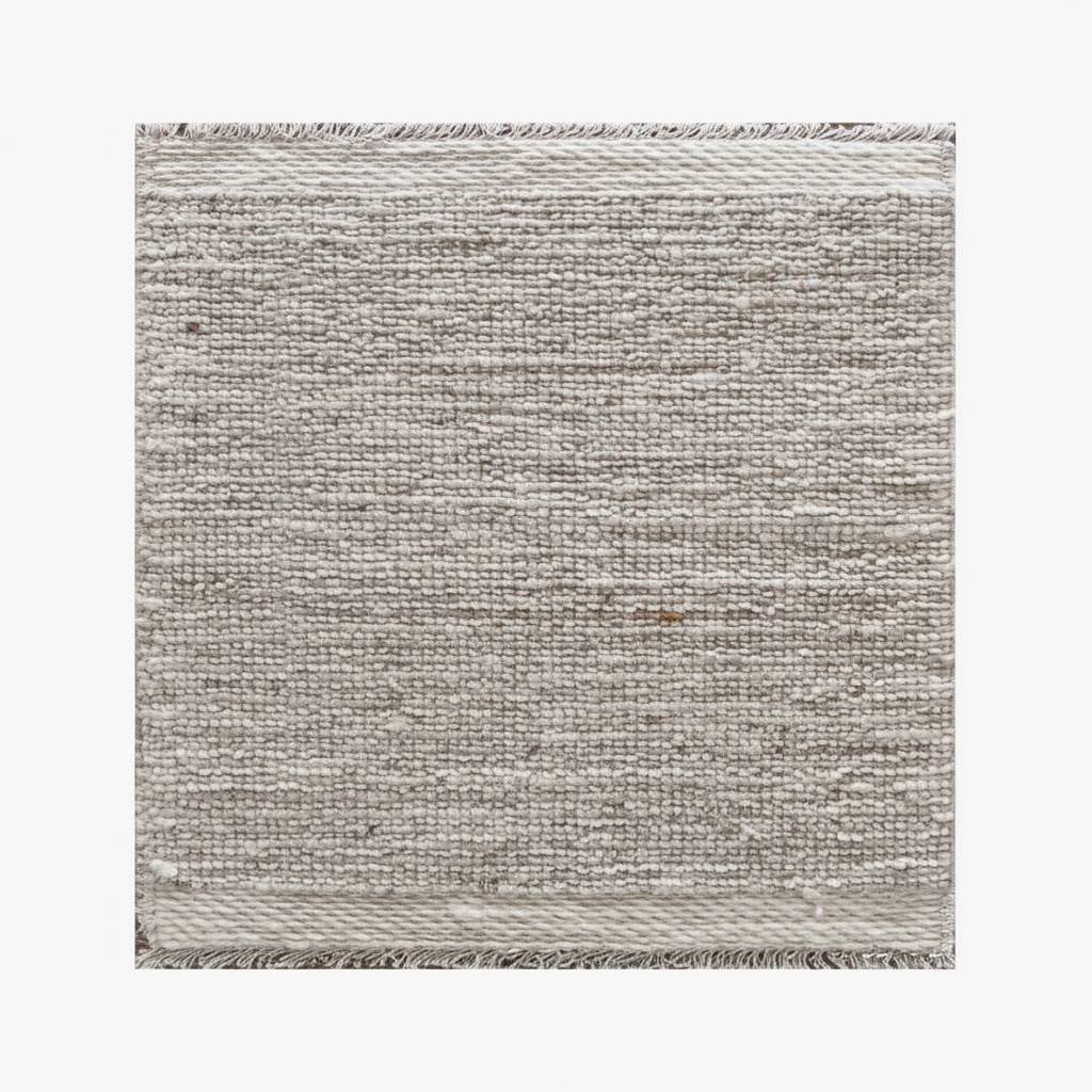 Textured gray rug with a subtle pattern on a white background