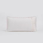 Rectangular white pillow with textured pattern on a light gray background